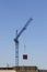 A construction crane moves the load. Building materials on pallets. Construction of a modern residential building