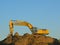 Construction crane on a pile of soil