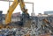 Construction Crane Removing the trash remains from a Demolished Building