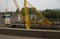 Construction crane works at a dam lock on the river in Germany.