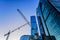 Construction cranes and towers of the Moscow-City international business center in the winter evening against the blue sky. Moscow