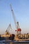 Construction cranes work in the port of Helsinki in winter