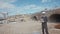 Construction engineer using a drone for aerial photography in a construction site