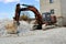 Construction excavator at an industrial gypsum stone processing plant. Mineral Loading