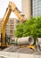 Construction Excavator Lifting Concrete pipes