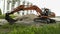 Construction excavator near the construction site