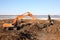 Construction - Excavators and bulldozer work in dirt