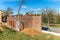 Construction of a family house. Stone fence. In the morning on the construction site. Gabion wall caged stones