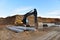 Construction of foundation excavator works in sand pit. Groundworks, site levelling, construction of reinforced ground beams on