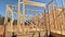 Construction frame house of wooden beam framework on stick new build home