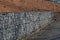 construction of a gabion retaining wall, as part of the house fencing.