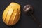 Construction helmet and judges gavel on black background. Top view. Construction and law