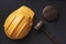 Construction helmet and judges gavel on black background. Top view. Construction law concept