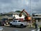 Construction Hitachi Bulldozer tears down home and lots material into truck