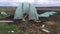 Construction of a homemade greenhouse made of boards, fittings and polyethylene