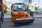 Construction Industry Fair Bauma CCT Russia. Orange utility truck Mercedes-Benz Unimog U423 with rotatry brush for