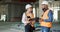 Construction, inspection and clipboard, black man and woman discussion, construction site with scaffolding and building