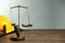 Construction and land law concepts. Gavel, scales of justice, hard hat and hammer on wooden table, space for text