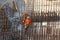 Construction of a large commercial building. Worker connects the armature at the construction site.