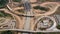 Construction of a large road junction at the entrance to a big city, aerial view