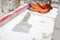 construction level, spatula and orange gloves are on the foam blocks on the construction of a country cottage