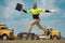 Construction man excited jump with helmet. Builder in helmet outdoor portrait. Worker in hardhat. Construction engineer