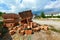 Construction Materials. Building materials for construction of residential complex. Pile of red bricks and scattered
