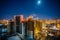 Construction of modern high multistory residential buildings, night aerial view of building yard