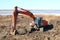 Construction of moorings for the parking of boats - Excavator work in dirt