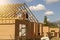 Construction of a new European-style house. Fragment of a new European-style home construction framing against a blue sky.