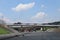 Construction of a new highway. A convoy of cars on a detour route. Bridge.