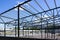 Construction of a new modern industrial building, metal truss frame