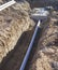 Construction new septic sewage tank sewer pipe trench system installation