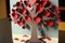 Construction paper craft tree with hearts for Valentines Day