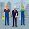 Construction people. Engineer in suit with drawings and couple of workers in overalls on a cityscape background.
