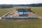 Construction and repair of country houses. New cottage with double-glazed windows on the plot. Aerial view from a drone to a