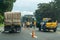 Construction roadworks at the highway. Freeway maintenance workers.