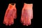 Construction rubberized gloves non-slip orange color on a black background, isolate