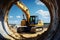 Construction scene: Caterpillar excavator digs with force against blue sky, near concrete pipe.