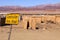 Construction sign located near vineyard workers straw huts in South Africa