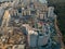 Construction site with building cranes and other equipment, industrial built or estate development modern buildings, aerial view