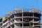 Construction site of a building with scaffolding. Industrial image