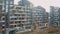 Construction site, building work process in modern apartment panel house, block of flats. Unfinished structure, exterior