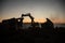 Construction site on a city street. A yellow digger excavator parked during the night on a construction site. Industrial concept t