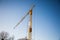 Construction site with crane, blue sky