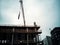 Construction site crane is lifting a precast