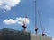 Construction site with cranes with blue sky.