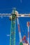 Construction site with cranes with blue sky