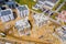 Construction site with cranes. Construction workers are building. Aerial view of construction site of residential area buildings