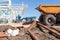 Construction site with dumper truck and partially built buildings